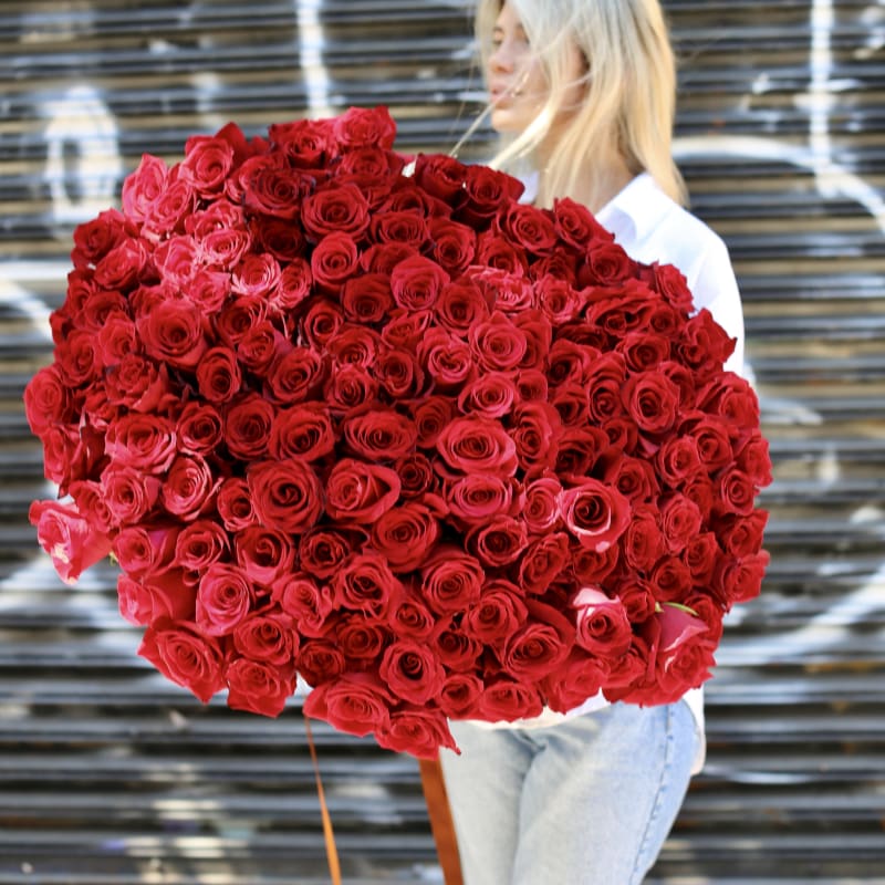 Handcrafted bouquet featuring deep crimson roses, perfect for elegant celebrations