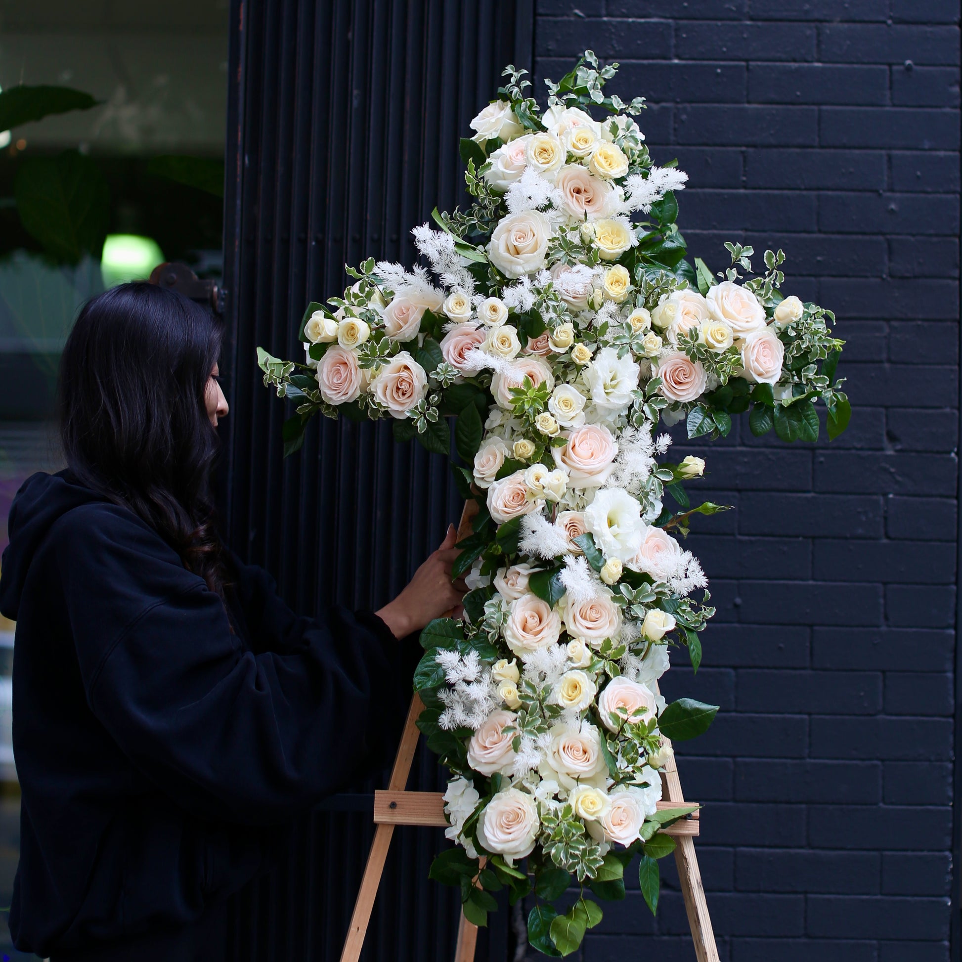 Rest in Peace bouquet from Pink Clover LA, featuring delicate white blooms and green accents