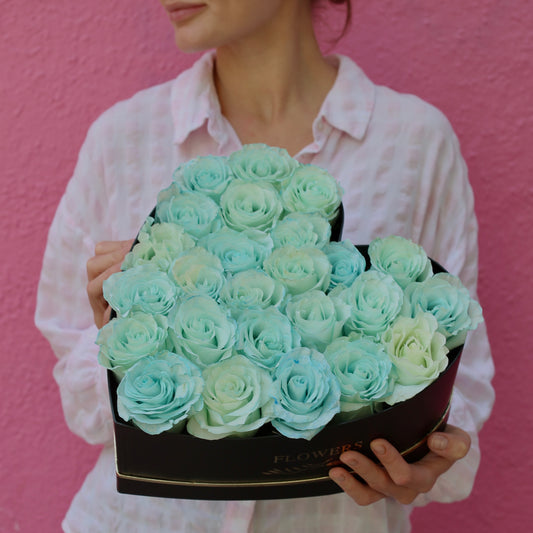 Luxurious blue rose bouquet with silver accents, ideal for romantic elegance