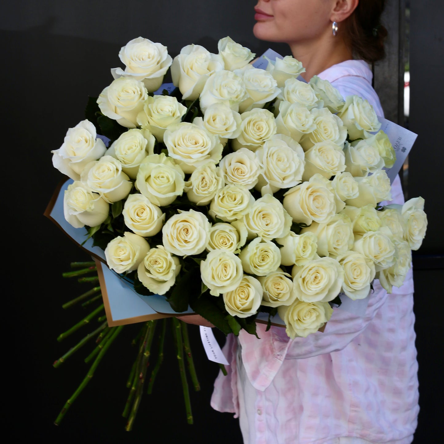 Handcrafted bouquet featuring pristine white roses, perfect for tranquil decor