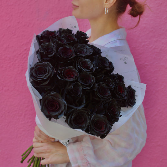 Elegant bouquet of burgundy and ivory flowers, ideal for dramatic celebrations
