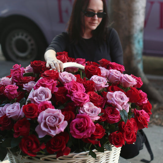 A romantic bouquet of red roses and eucalyptus, symbolizing love and devotion—perfect for Valentine’s Day surprises.