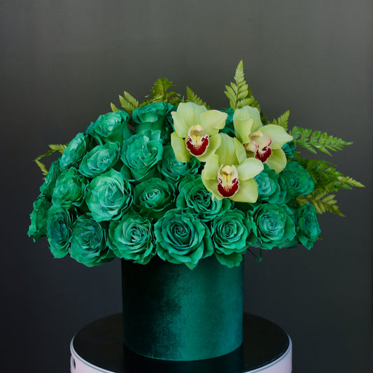 Dark green floral arrangement with roses and eucalyptus, ideal for modern elegance