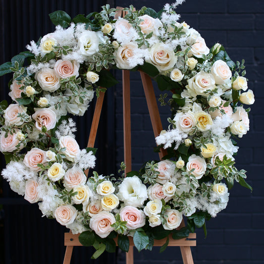 Loving Tribute bouquet from Pink Clover LA, featuring delicate blooms and green accents