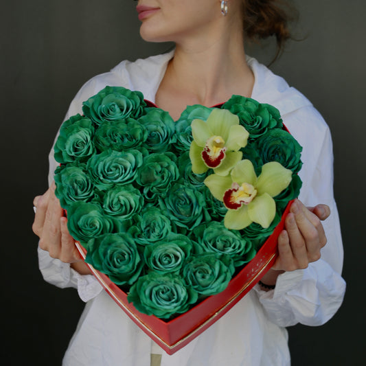 Regal emerald-green bouquet with anthuriums and tropical foliage, styled for bold elegance