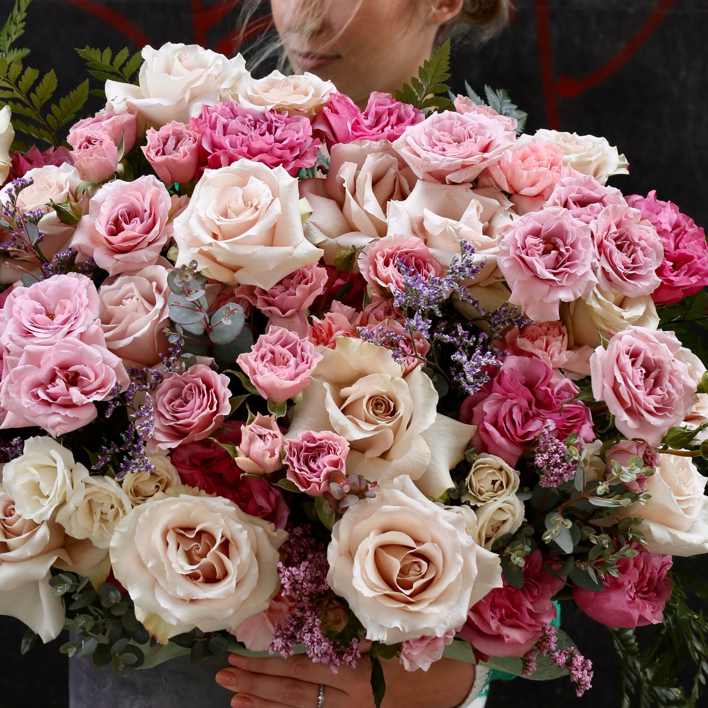 Delicate floral arrangement featuring blush roses and natural textures, ideal for romantic occasions and home décor.