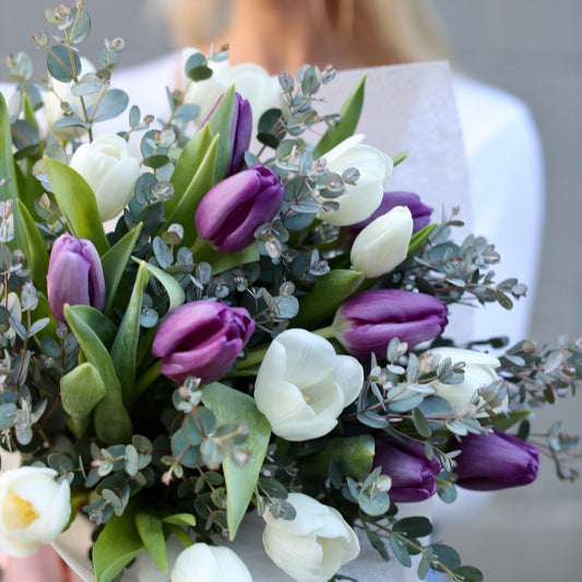 Vibrant Hazel Tulip Bouquet with 30 mixed-color tulips beautifully arranged in a clear glass vase – ideal for premium gifting