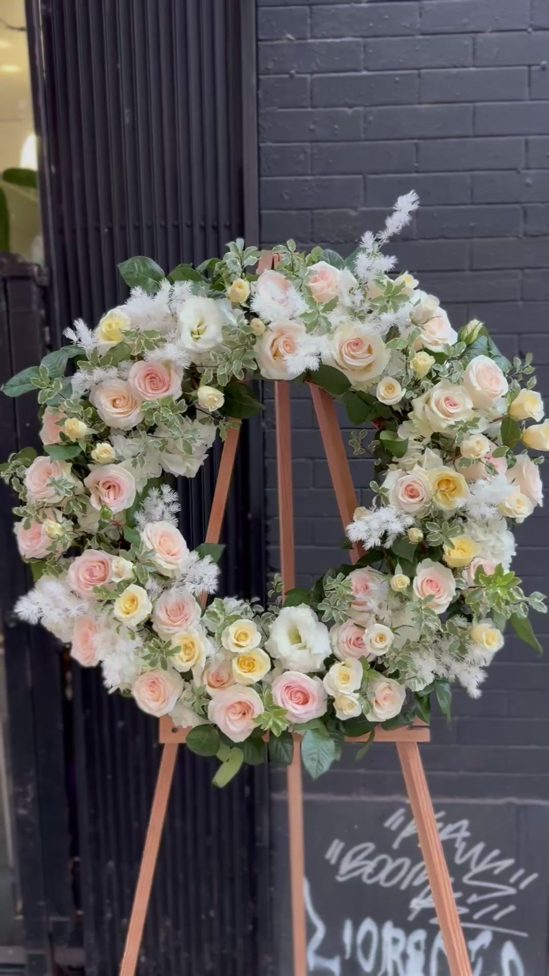 Loving Tribute bouquet from Pink Clover LA, featuring delicate blooms and green accents