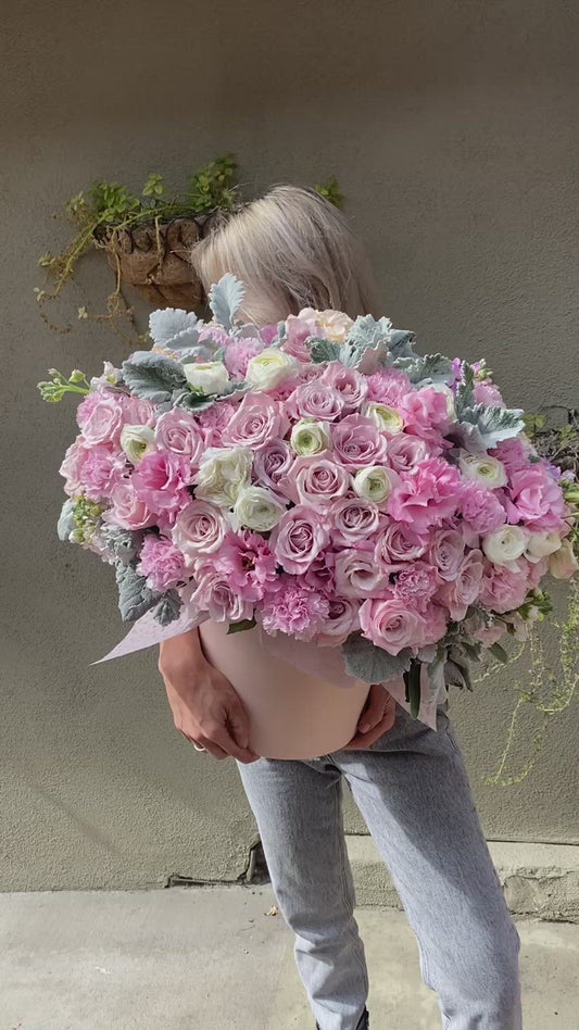 Luxurious Pink Heaven bouquet featuring roses, hydrangeas and ranunculus, beautifully styled for premium floral delivery