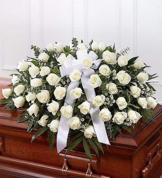 Serene Casket Cover Memory featuring white roses and Monte Casino blooms, elegantly arranged for funeral tributes and premium floral delivery