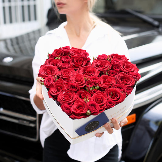 Romantic heart-shaped floral arrangement with red roses in a luxury keepsake box, ideal for Valentine’s Day gifting