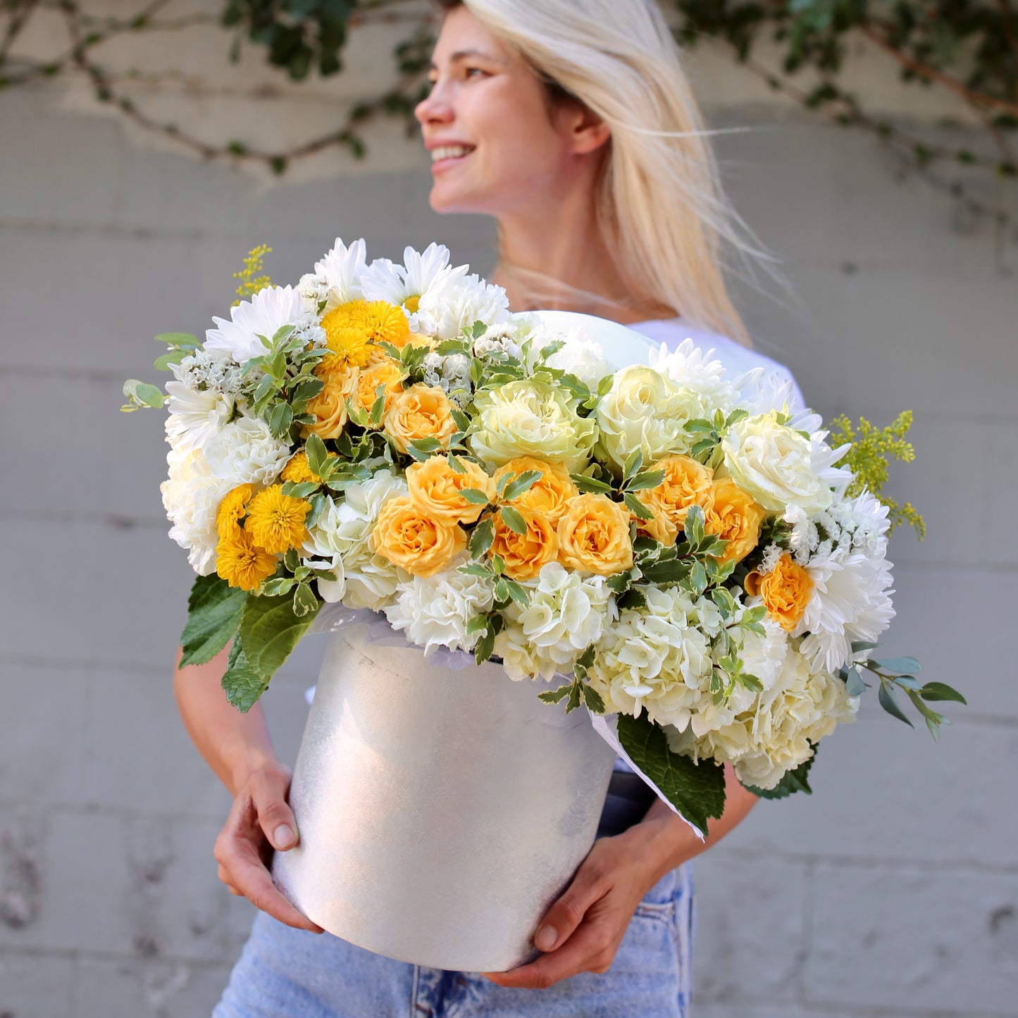 Vibrant yellow and white floral arrangement styled for premium delivery, perfect for birthdays and sentimental occasions