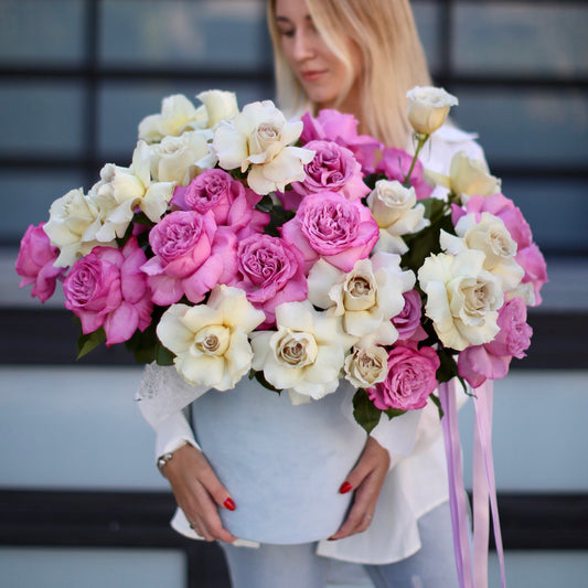 Luxurious floral gift featuring a mix of pink and white roses elegantly arranged in a decorative keepsake box