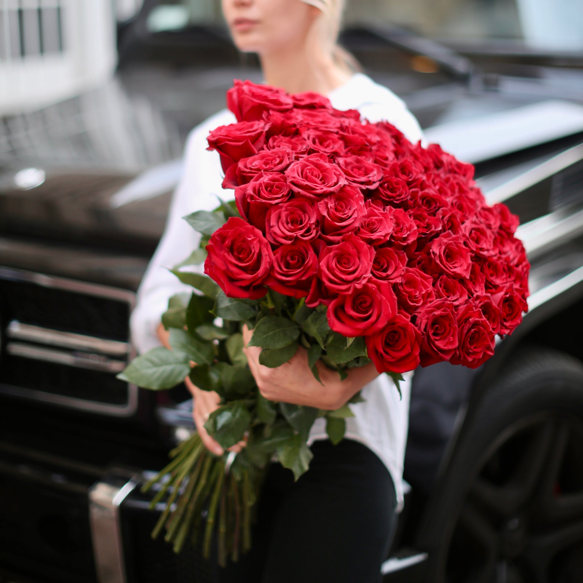 Vibrant red roses bouquet showcasing 75 premium blooms, styled for luxury gifting and special celebrations