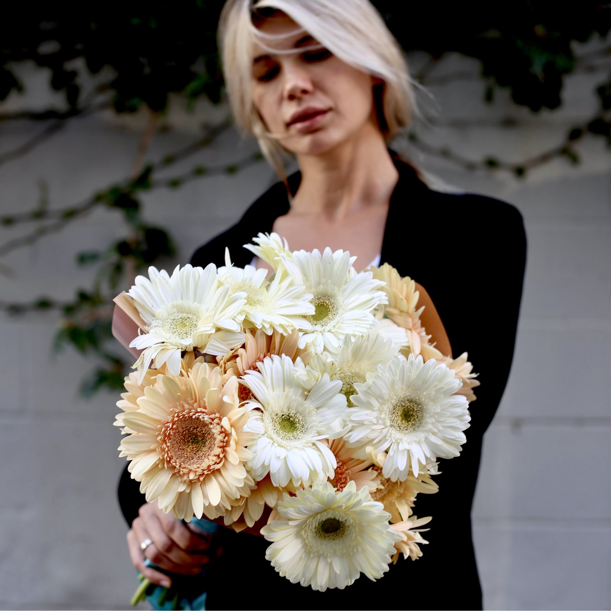 Handcrafted Sandra bouquet featuring soft-toned gerberas in a sophisticated vase presentation, beautifully styled for luxury home décor and celebrations