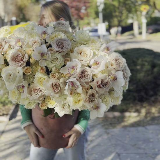 Premium white flower arrangement showcasing pristine blooms in a minimalist yet luxurious presentation