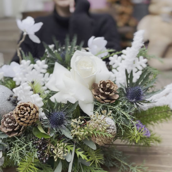 Luxurious Christmas flower design in white and green tones, ideal for seasonal gifting and holiday decor