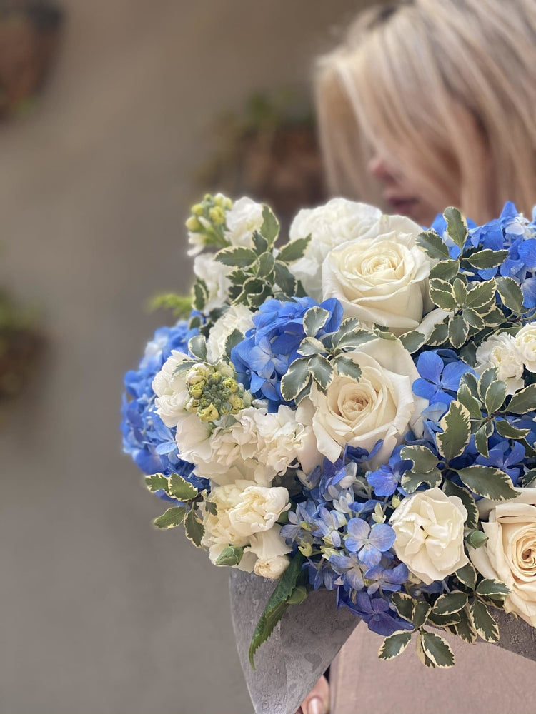
                  
                    Dora( Arrangement of blue hydrangea stachys and roses in box) - Los Angeles Florist - Pink Clover
                  
                