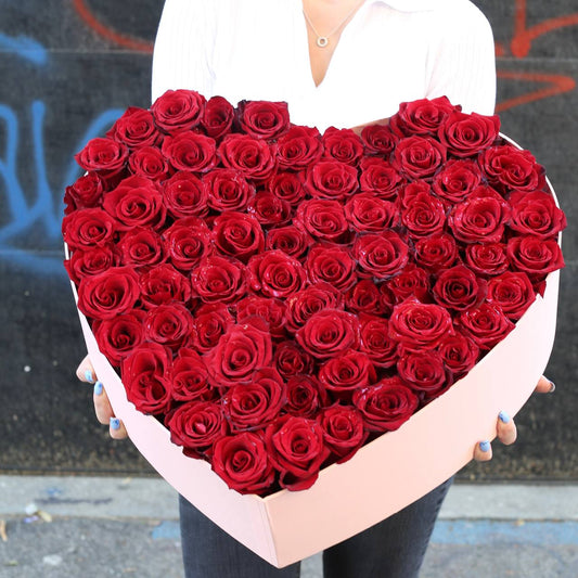 Luxurious heart-shaped box filled with 75 fresh red roses, designed for romantic occasions and luxury gifting