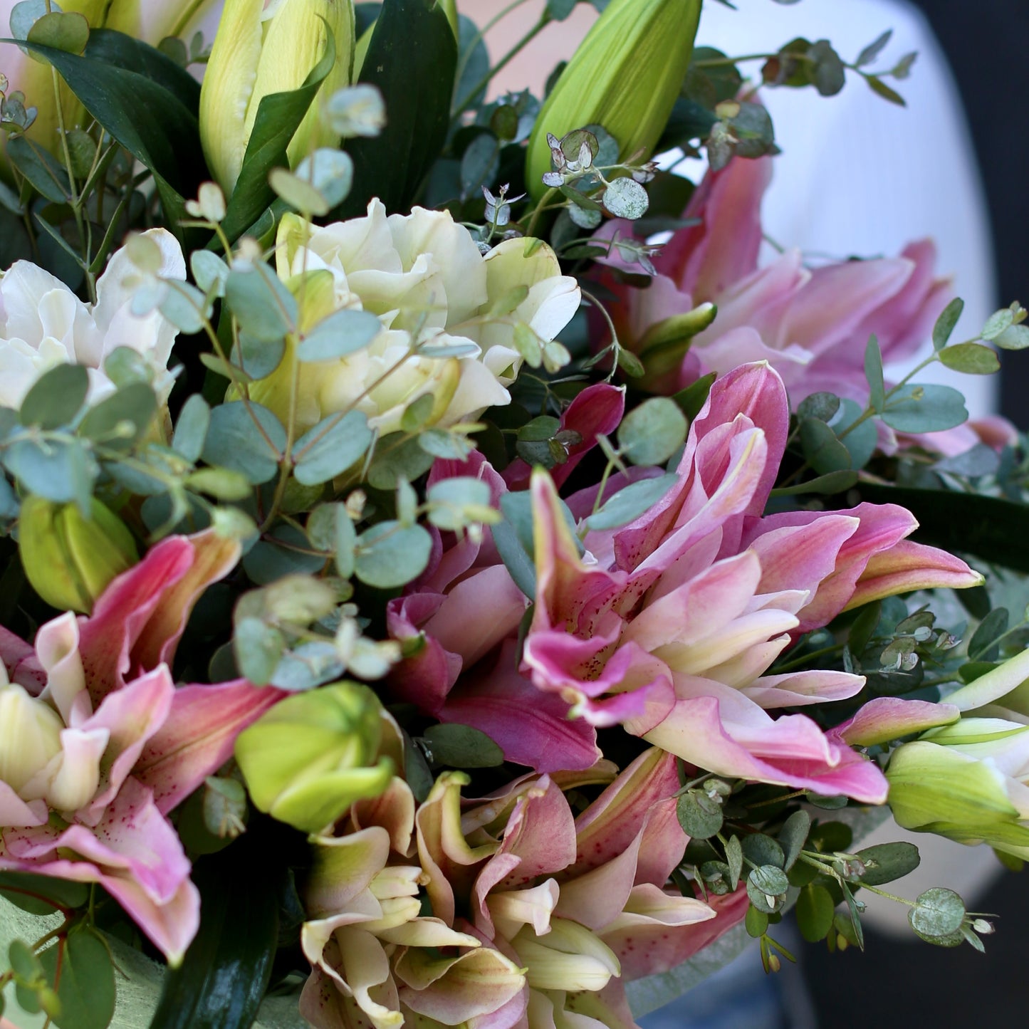 
                  
                    Bouquet with lilies and eucalyptus
                  
                